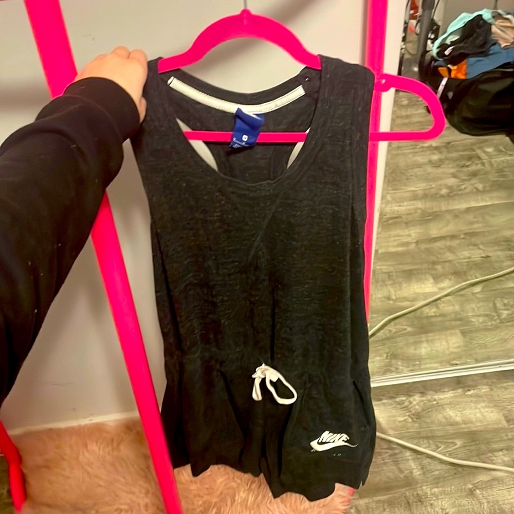 This is a medium black Nike romper! Has pockets very comfortable